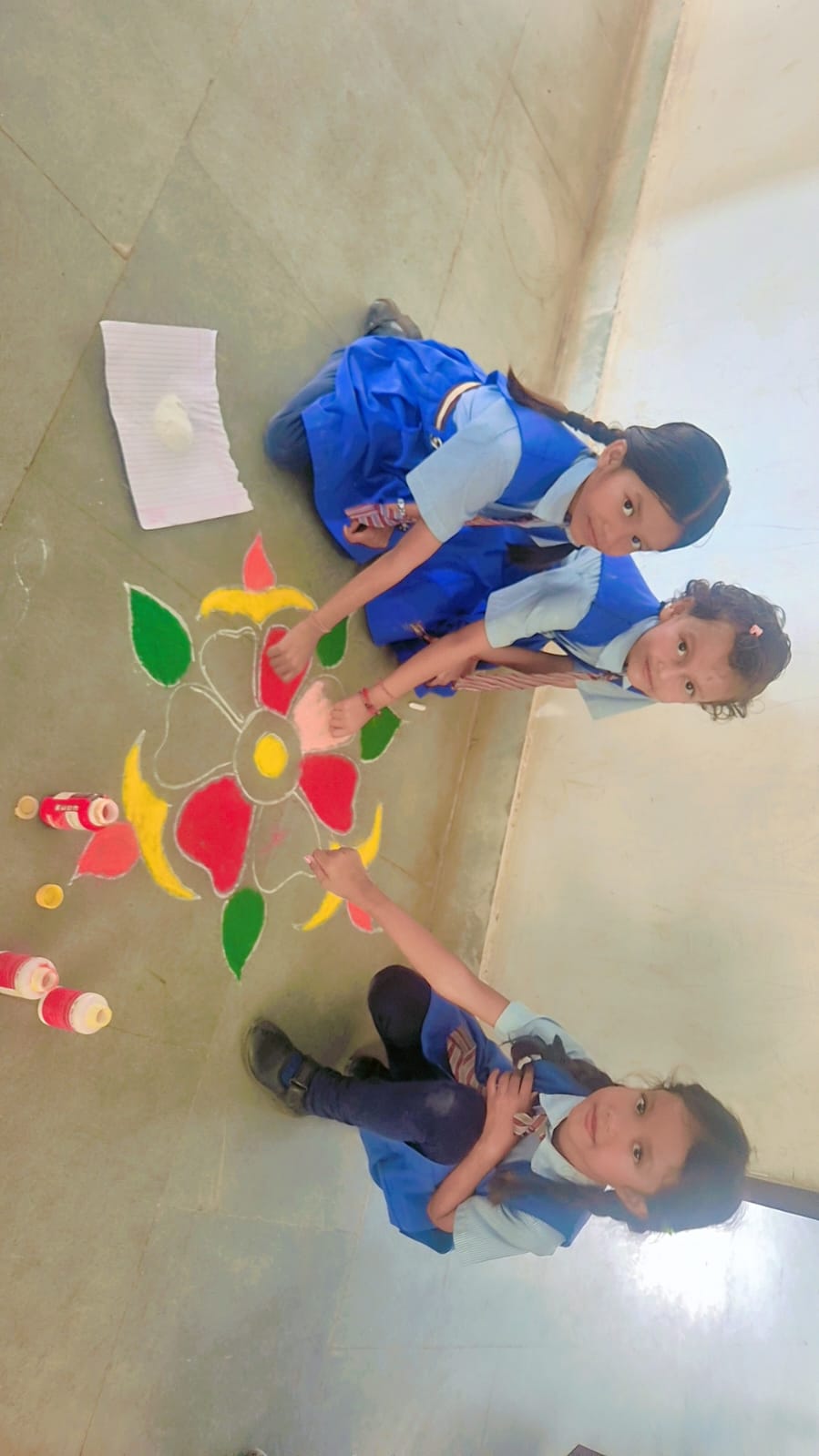 Students making Rangoli